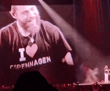 a man with a beard is wearing a black shirt that says i love copenhagen