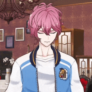 a boy with pink hair is wearing a blue jacket with a tiger patch