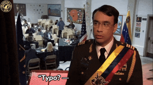 a man in a military uniform is standing in front of a crowd and says " typo "
