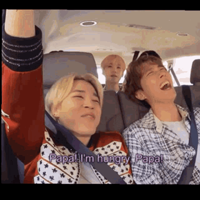 a group of young men are sitting in a car and one of them says " papa i 'm hungry papa "