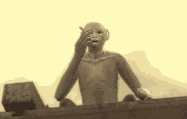 a statue of a man smoking a cigarette with a yellow background
