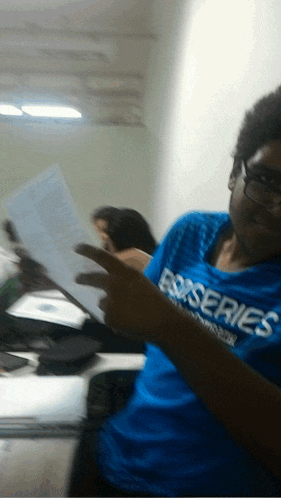 a person wearing a blue shirt that says series