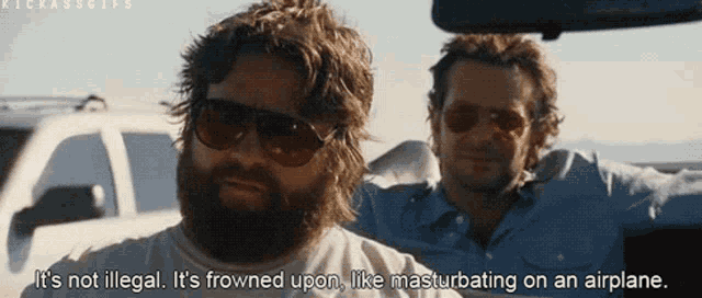 a man with a beard wearing sunglasses says it 's not illegal