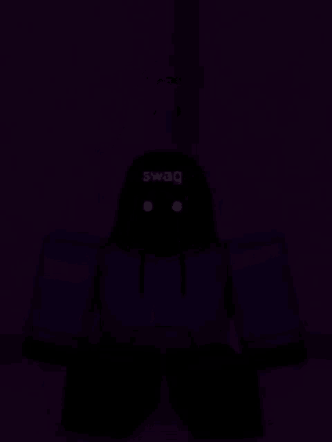 a person in a blue shirt is standing in the dark with a purple background .