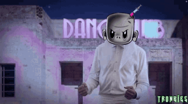 a man is dancing in front of a building that says dang club