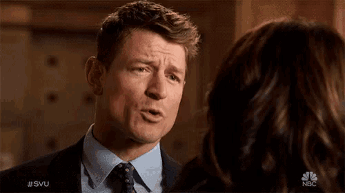 a man and a woman looking at each other with the hashtag #svu