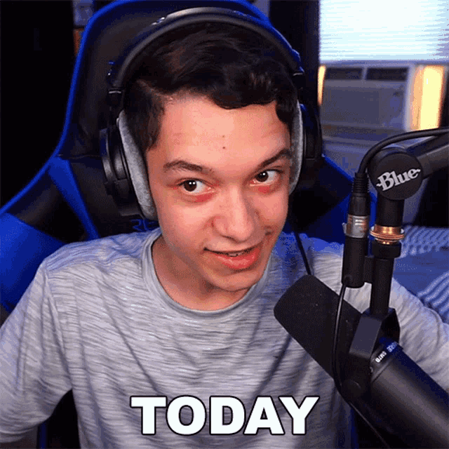 a man wearing headphones and a microphone says today