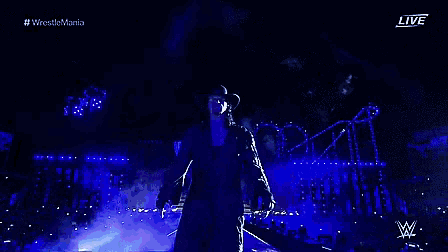 wrestlemania is being shown live on a screen