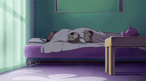 a person is sleeping on a purple bed with a teddy bear on top of it .