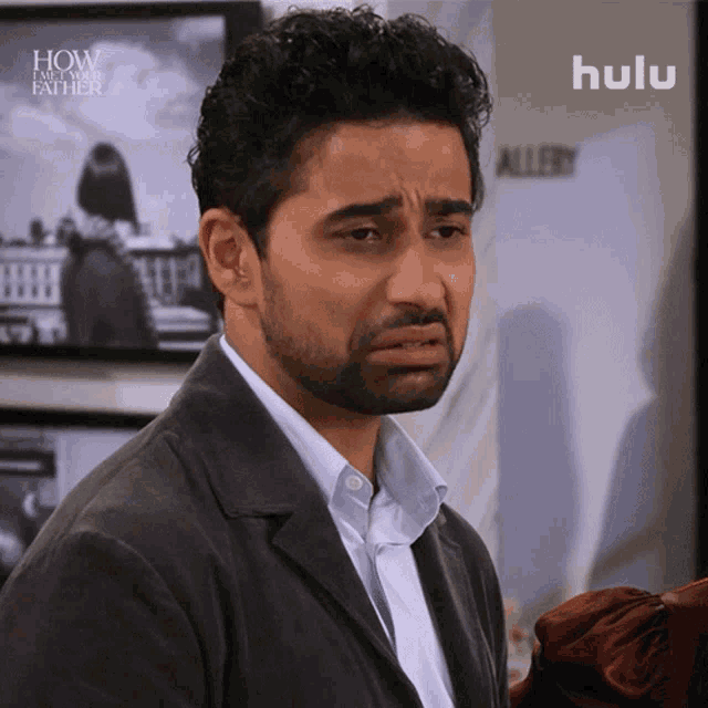 a man with a beard is on a hulu ad