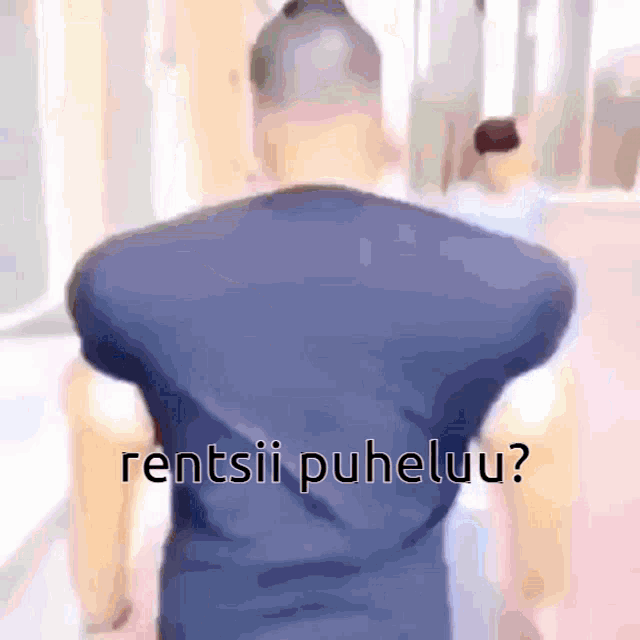 a blurry picture of a man with rentsii puheluu written on the back of his shirt