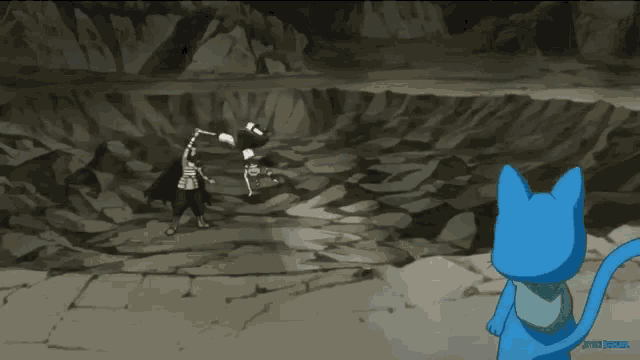 a blue cat is standing in front of a rocky area