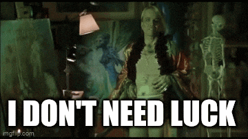 a woman standing in front of a painting with the words " i don 't need luck "