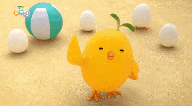 a yellow toy chicken is surrounded by white eggs and a green ball