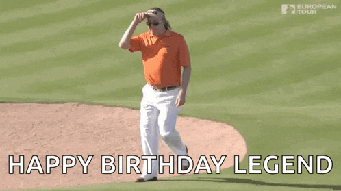 a man in an orange shirt and white pants is walking on a baseball field with the words `` happy birthday legend '' written below him .