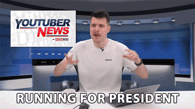 a man in a white shirt stands in front of a youtuber news sign