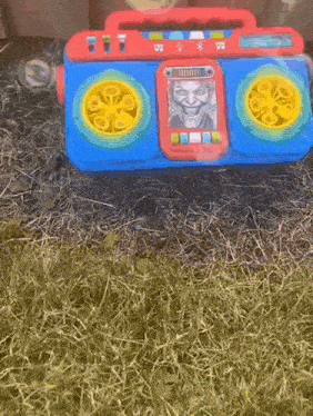 a toy boombox with a picture of the joker on it