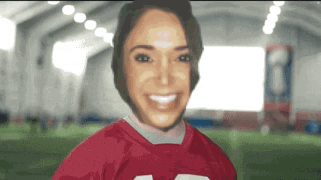 a woman is wearing a red jersey with the number 15 on it