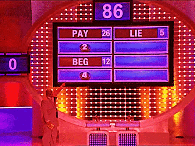 a man stands in front of a screen that says pay 26 lie 5 and beg 12