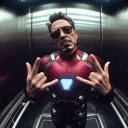 a man in an iron man suit is sitting in an elevator .