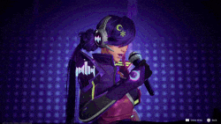 a woman in a futuristic outfit is singing into a microphone while wearing headphones