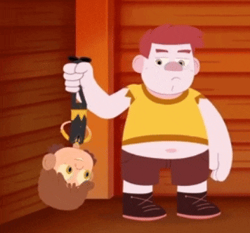 a cartoon character is holding a person 's head upside down while standing next to a wooden wall .