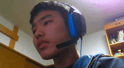 a young man wearing a pair of headphones with a microphone