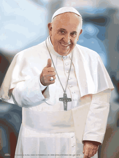 a man in a white robe is giving a thumbs up sign