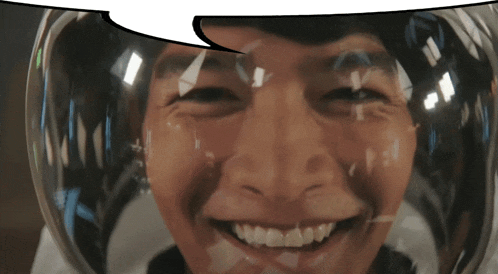 a man wearing a helmet with a speech bubble above his head