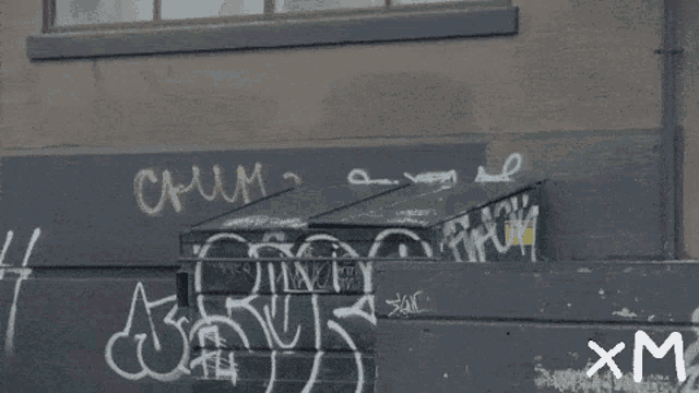 a sign that says good morning miner 's with graffiti on the side