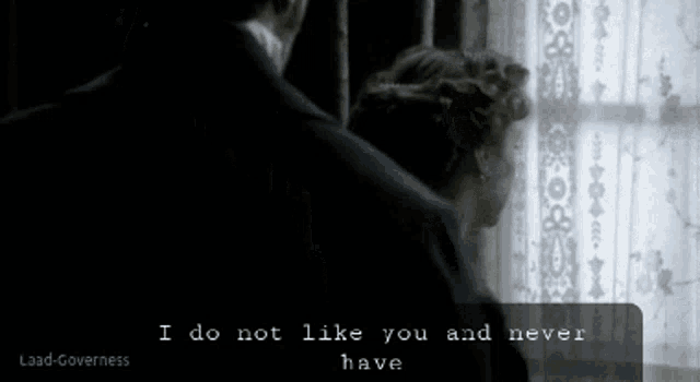 a woman stands in front of a window with the words i do not like you and never have below her