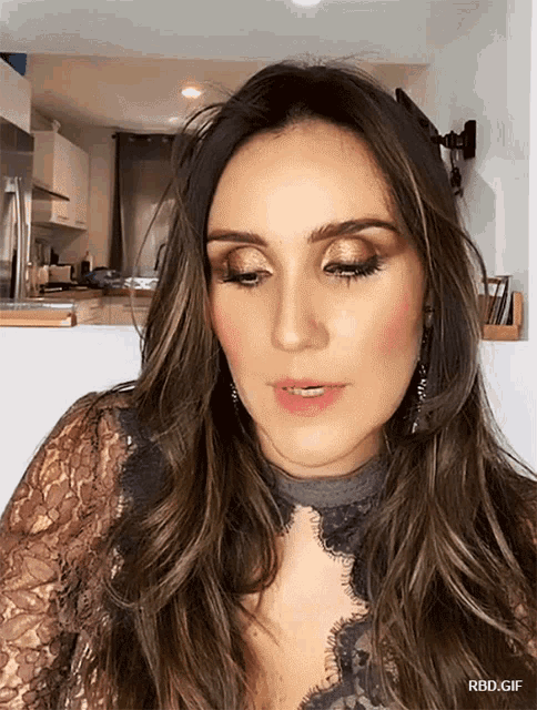a close up of a woman 's face with the words rbd.gif below