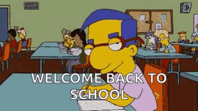 a cartoon character is sitting at a desk with the words welcome back to school written below him