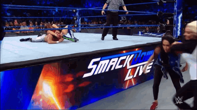 a wrestling match is being shown on the smack down live channel