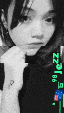 a woman with a tattoo on her wrist that says love on it