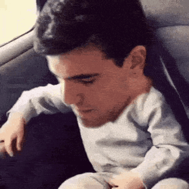 a man with a baby 's head on his shoulder