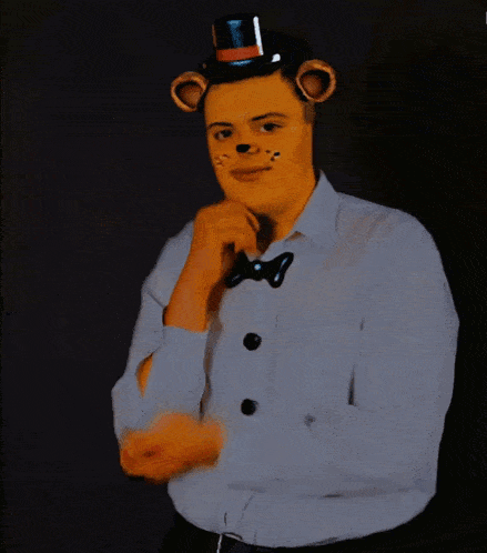 a man wearing a teddy bear costume and a top hat