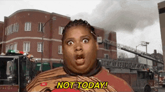 a woman is standing in front of a fire truck and says " not today "