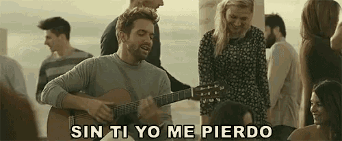 a man singing and playing a guitar with sin ti yo me pierdo written above him