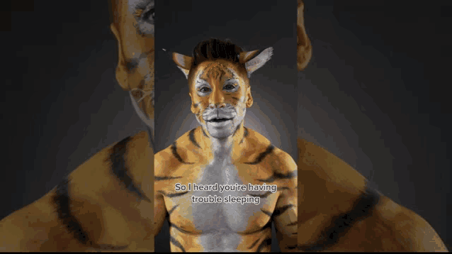 a man with his face painted like a tiger is saying so i heard you 're having trouble sleeping