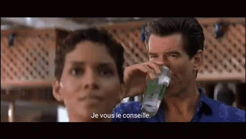a man is drinking a glass of water next to a woman who says je vous le conselle