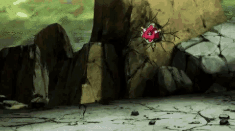 a cartoon character is sitting on top of a rock in a cave .