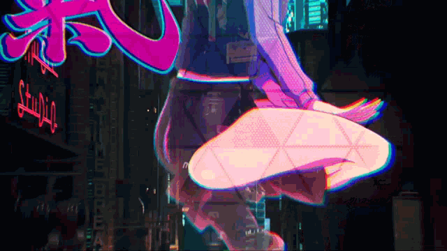 a neon sign that says studio is in the background