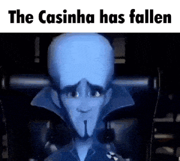 a cartoon character with a big head is sitting in a chair with the words `` the casinha has fallen '' .