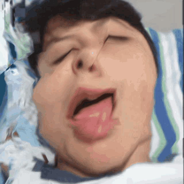 a close up of a person with their tongue sticking out