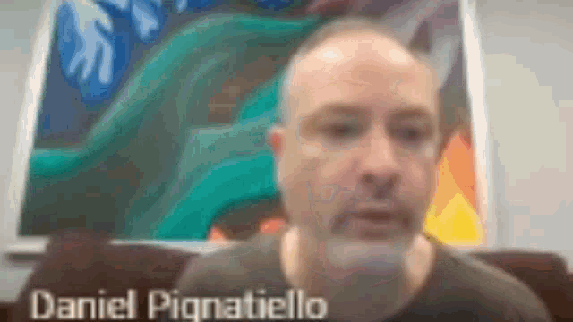 a blurry picture of a man with the name daniel pognatiello