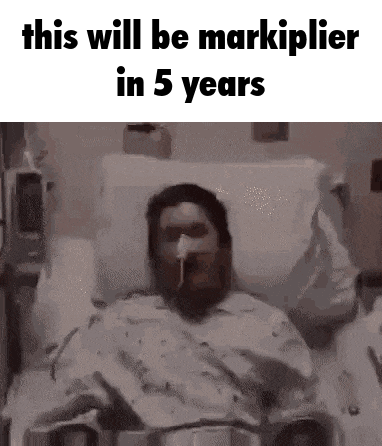 a man is laying in a hospital bed with a ventilator on his face .