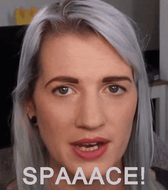 a close up of a woman 's face with the words spaaace written below her