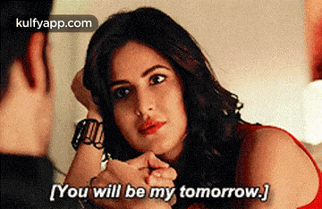 a woman is looking at a man and says you will be my tomorrow