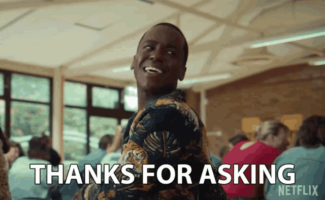 a man is smiling and says thanks for asking